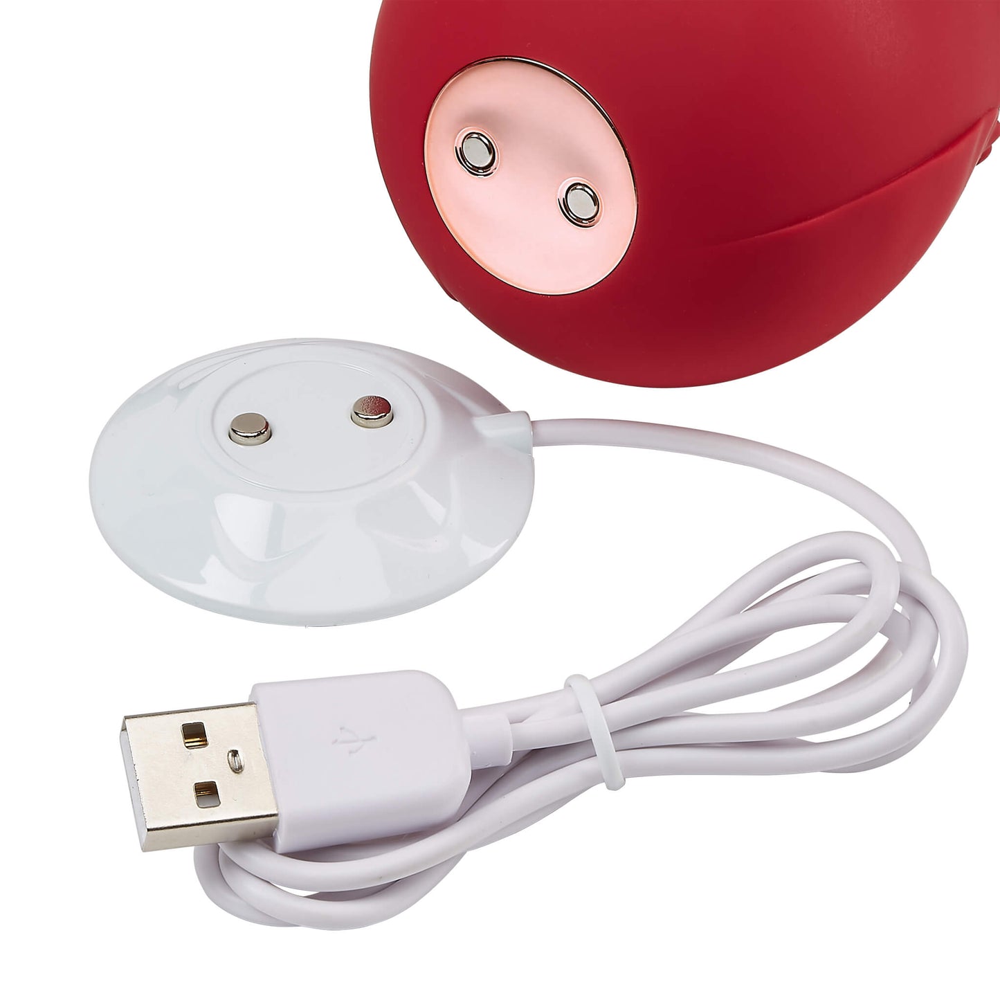 Close-up of the Cloud 9 Rose Suction Stimulator charging base and the magnetic ports on the underside of the Rose vibe that function as the charging ports. The charging base's cord ends in a USB dongle that will need to be plugged into an adapter or a USB port for charging. | Kinkly Shop