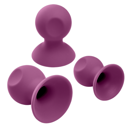 Cloud 9 Nipple Sucker and Clit Sucker Set with two suckers tipped over to show the interior, hollow design that works for the suction | Kinkly Shop
