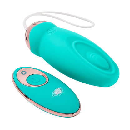 Pulsating version of the Cloud 9 Wireless Remote Control Eggs laying next to its remote control. The Pulsating version has a wave-like divet on one side of the toy where a small area "pulses" in and out from the toy when turned on | Kinkly Shop