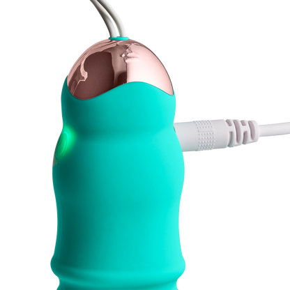 Image displays cord plugged into the Cloud 9 Wireless Remote Control Egg while the vibrator's light is lit-up to show that the vibrator is actively charging | Kinkly Shop