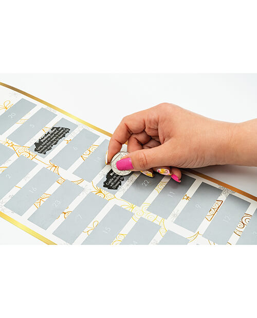 A hand is using a coin to scratch off one of the dares. (Day 8) Another challenge's day is already scratched off. | Kinkly Shop