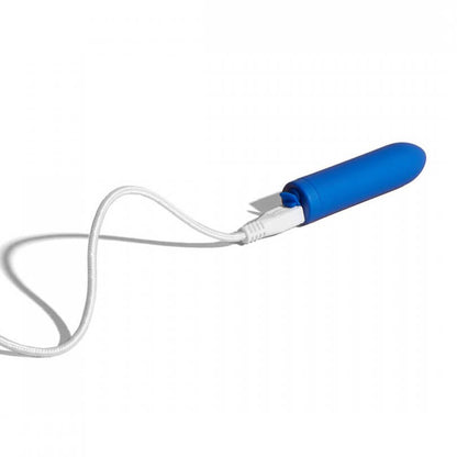 The charging cable plugged into the Dame Zee micro bullet vibrator. The image shows the charging port's cover opened up to make room for the cable to slide into the vibrator. | Kinkly Shop