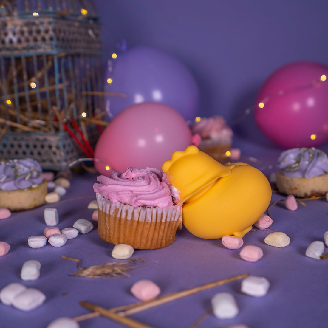 The Emojibator Chickie with its face smashed into a cupcake. | Kinkly Shop