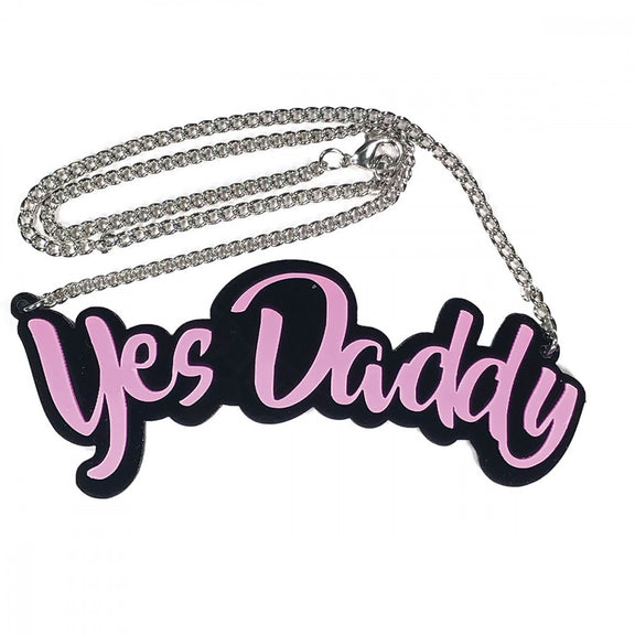 Close-up of the acrylic design of the Geeky & Kinky Yes Daddy Necklace | Kinkly Shop