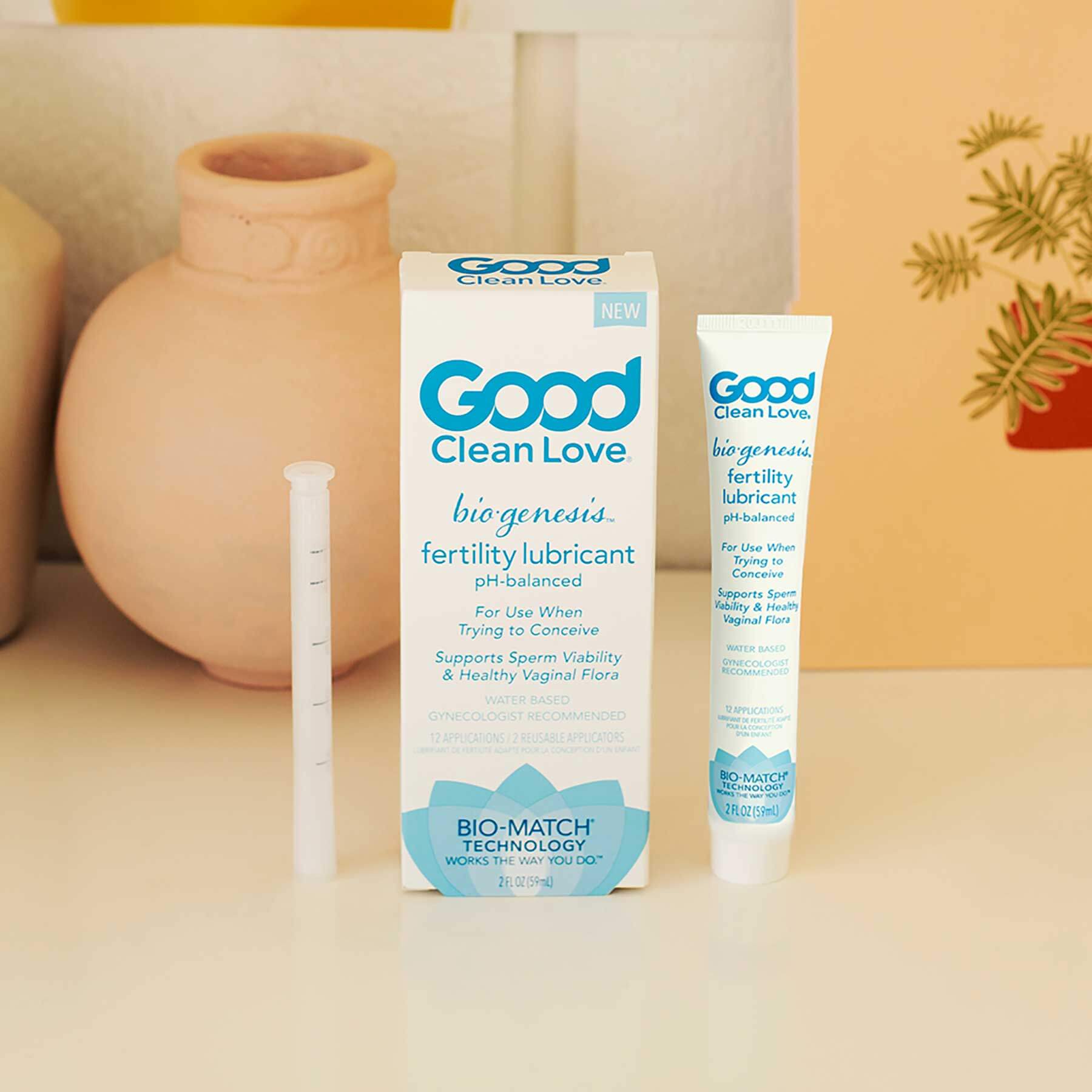 The packaging of the Good Clean Love BioGenesis™ Fertility Lubricant next to the bottle of lube sitting out | Kinkly Shop