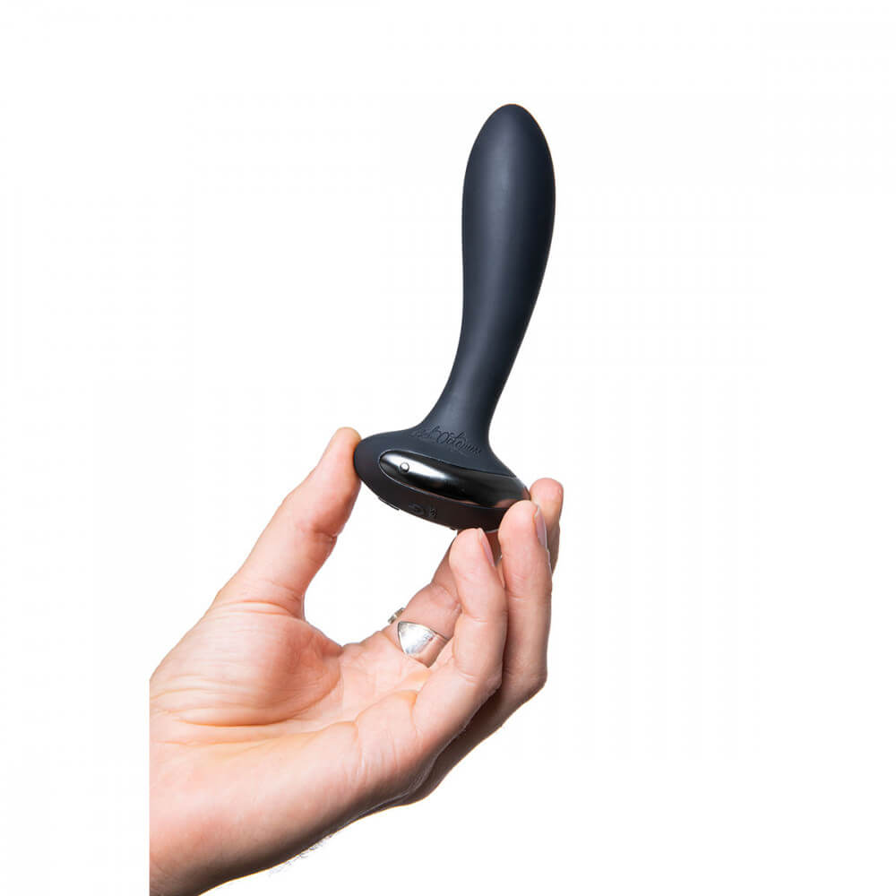 A hand holds the Hot Octopuss PleX with Flex. This provides a realistic size understanding of the Hot Octopuss PleX with Flex which looks to be clearly longer than a finger but definitely not wider than two finger's in width. | Kinkly Shop