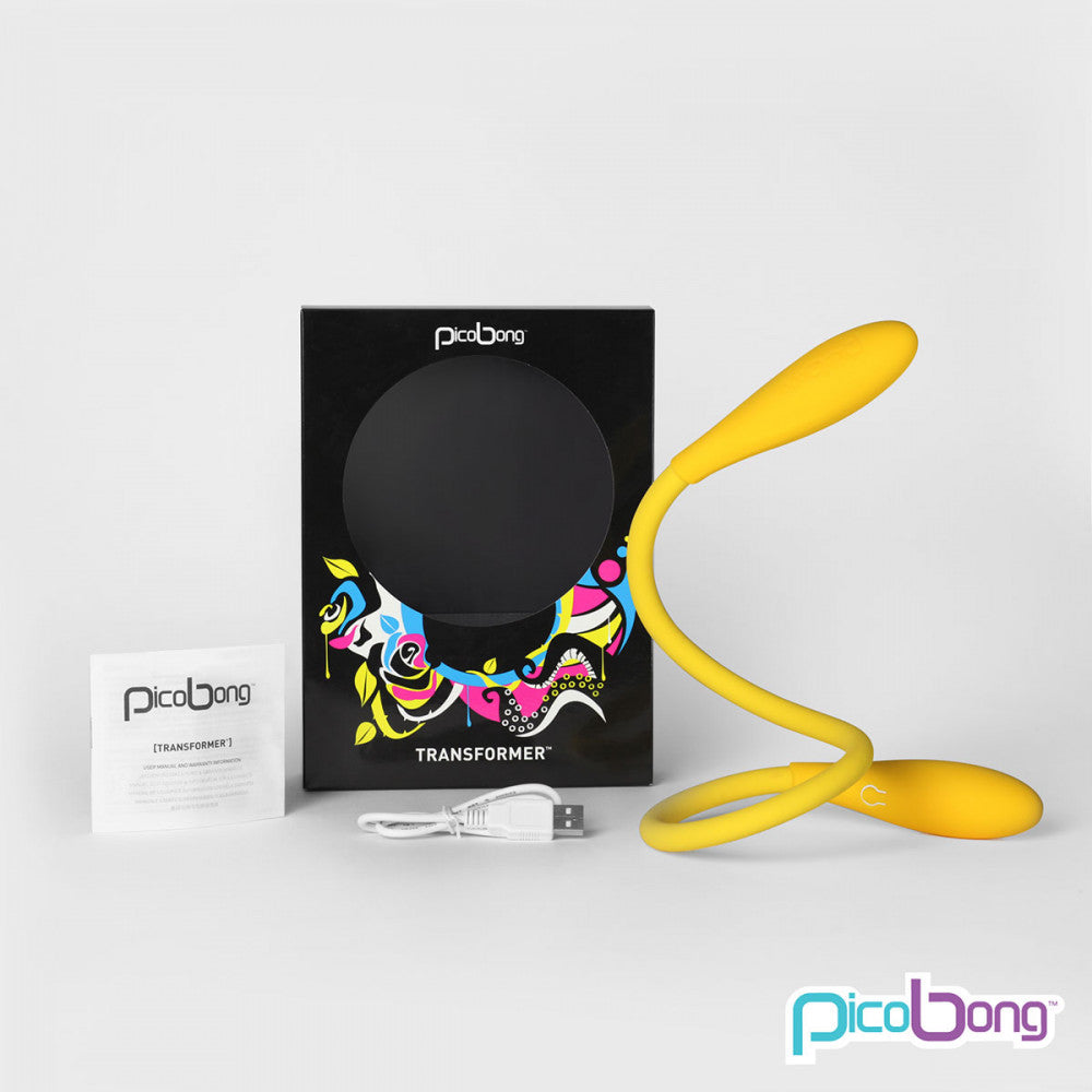 The PicoBong Transformer sitting next to its open packaging, included charging cable, and included instruction manual | Kinkly Shop