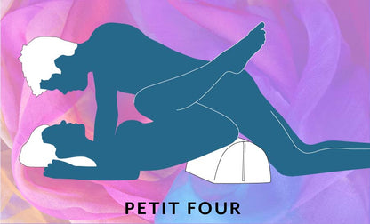 An illustrated sex position called the Petit Four that shows the receptive partner laying down on the ground with their hips slightly elevated by laying on top of the Liberator BonBon Sex Toy Mount. The penetrating partner leans on top of them, missionary-style, to enter them for a slightly modified missionary sex position. | Kinkly Shop