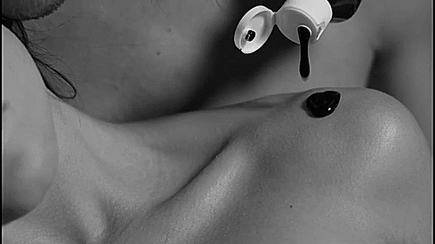GIF of the Liberator Love is Art promotional video. It shows a montage of black and white images of two naked people cuddling one another. Despite the couple being naked, the close-ups of the shots never show anything explicit, but it shows the two people spreading the body-friendly paint all over one another in an erotic fashion. | Kinkly Shop