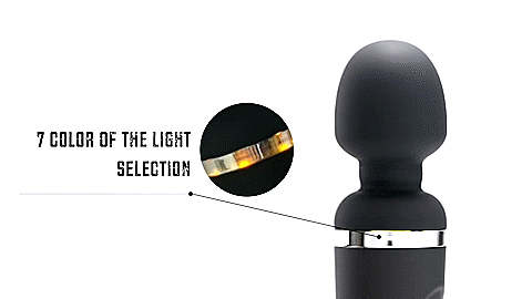 GIF of the Lovense Domi 2 shows the wand massager while it's on in front of a plain white background. The vibrator is shaking very visibly, and a close-up circle shows the color-changing lighted dial near the head of the massager as it scrolls through colors. The text reads "7 Color of the Light Selection". | Kinkly Shop