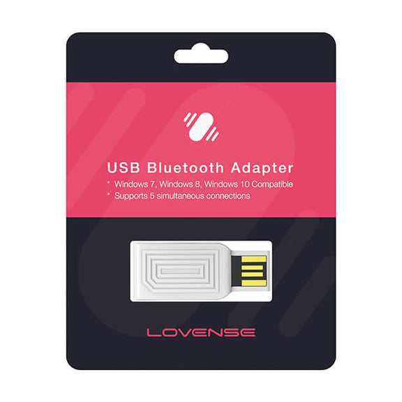 The Lovense USB Bluetooth Adapter inside of its packaging. The packaging is black and pink, and it states "USB Bluetooth Adapter. Windows 7, Windows 8, and Windows 10 Compatible. Supports 5 simultaneous connections. Lovense" | Kinkly Shop