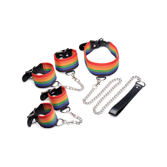 Rainbow wrist cuffs, rainbow ankle cuffs, and rainbow collar all sit out to display the Master Series Kinky Pride Rainbow Bondage Set | Kinkly Shop