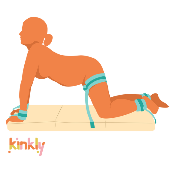 A person uses the Liberator Bondi. They are on all fours. Their wrists, ankles, and thighs are bound to the Bondi. | Kinkly Shop
