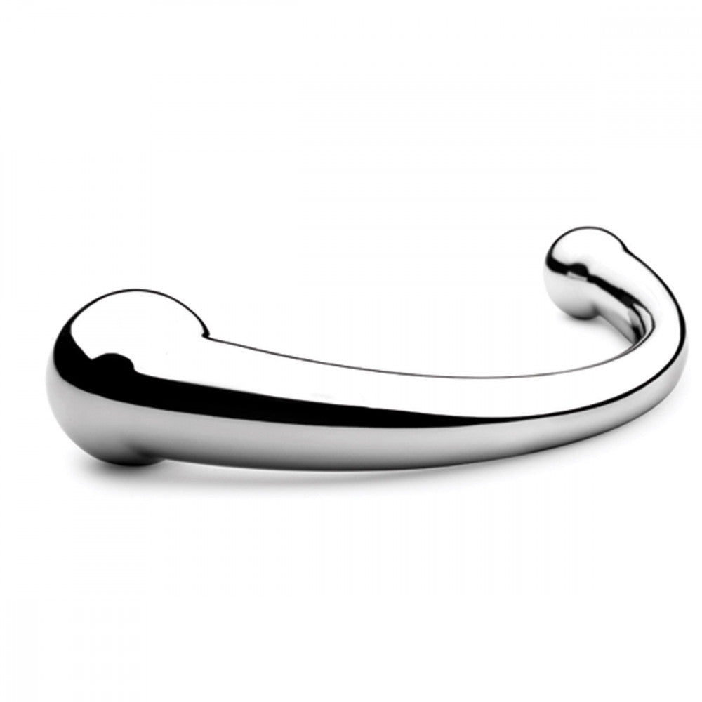 The njoy Pure Wand laying on a flat white surface. The larger end of the dildo is closest to the camera showing off the pronounced design of the bulb at the end. The dildo looks extremely shiny. | Kinkly Shop