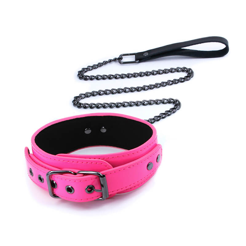 NS Novelties Electra Play Things Collar and Leash in Pink. The attached leash is a chain leash, and the handle of the leash is black. | Kinkly Shop
