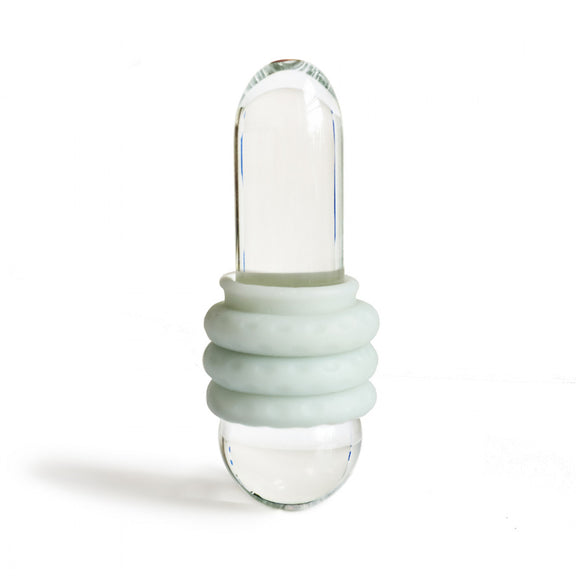 The OhNut Penetration Buffer rings wrapped around a glass cylinder. This shows how the rings can work on a penis - without showing a penis. | Kinkly Shop