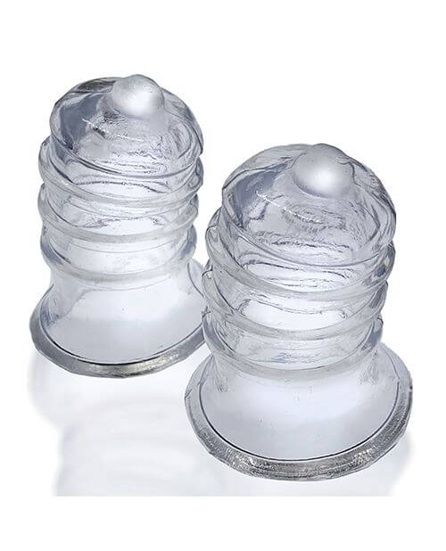 Oxballs Elong Nipsuckers in clear against a white background. It's easy to see through the clear variant to be able to see flesh inside of the suckers. | Kinkly Shop