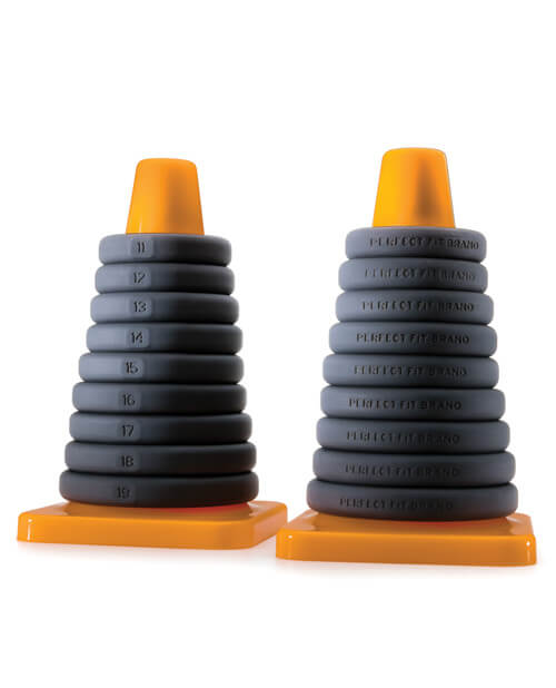 Two Perfect Fit Play Zone Cock Ring Sizing Kits sitting side by side. One view of the Perfect Fit Play Zone Cock Ring Sizing Kit shows the "front" side of each of the cock rings which shows the numbered system while the backside view (shown right next to it) shows the backside of all of the cock rings. | Kinkly Shop