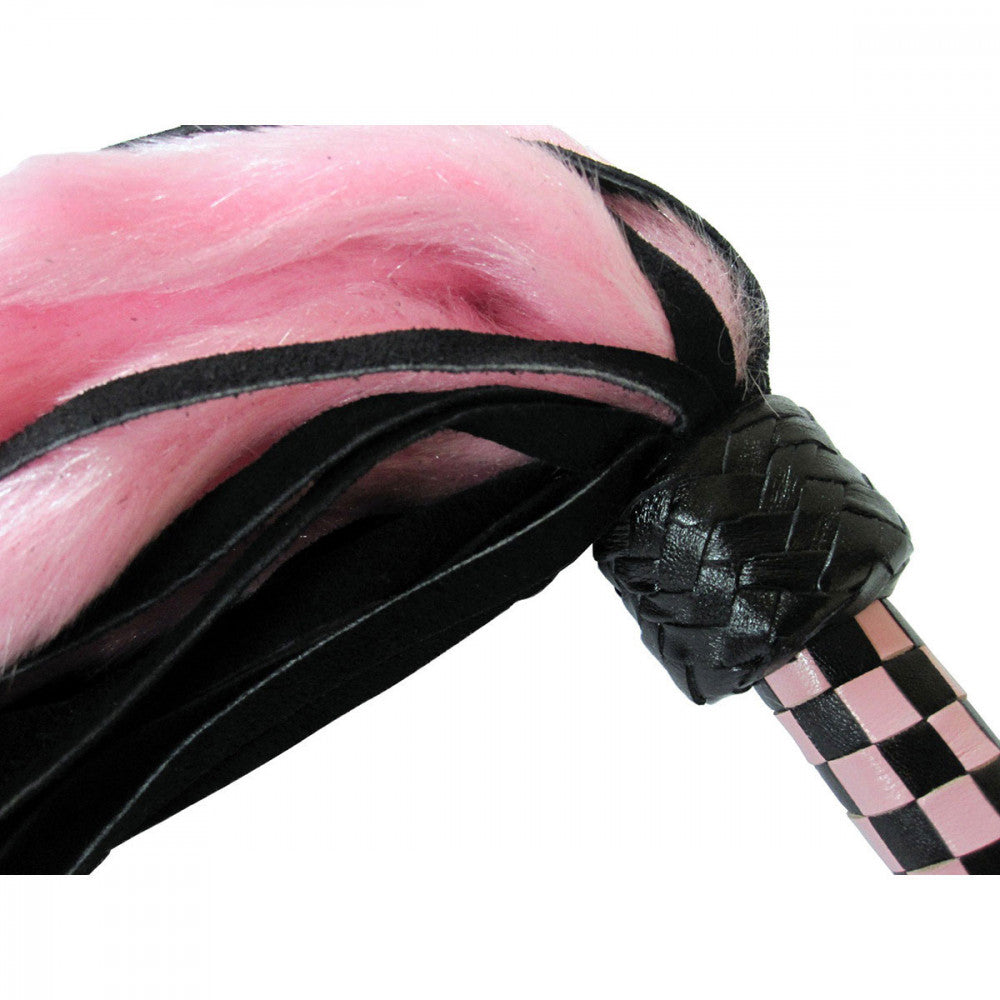 Detailed shot of the Ruff Doggie Styles Suede and Fluff Mini Flogger which shows the difference in fabric between the faux fur and the suede tails | Kinkly Shop