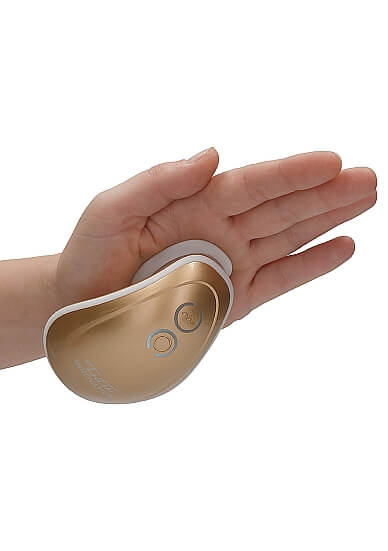 An open hand with the Shots Twitch Innovations attached. The Shots Twitch Innovations is suctioned to the hand without anyone holding onto the toy itself, with the palm facing the floor. | Kinkly Shop