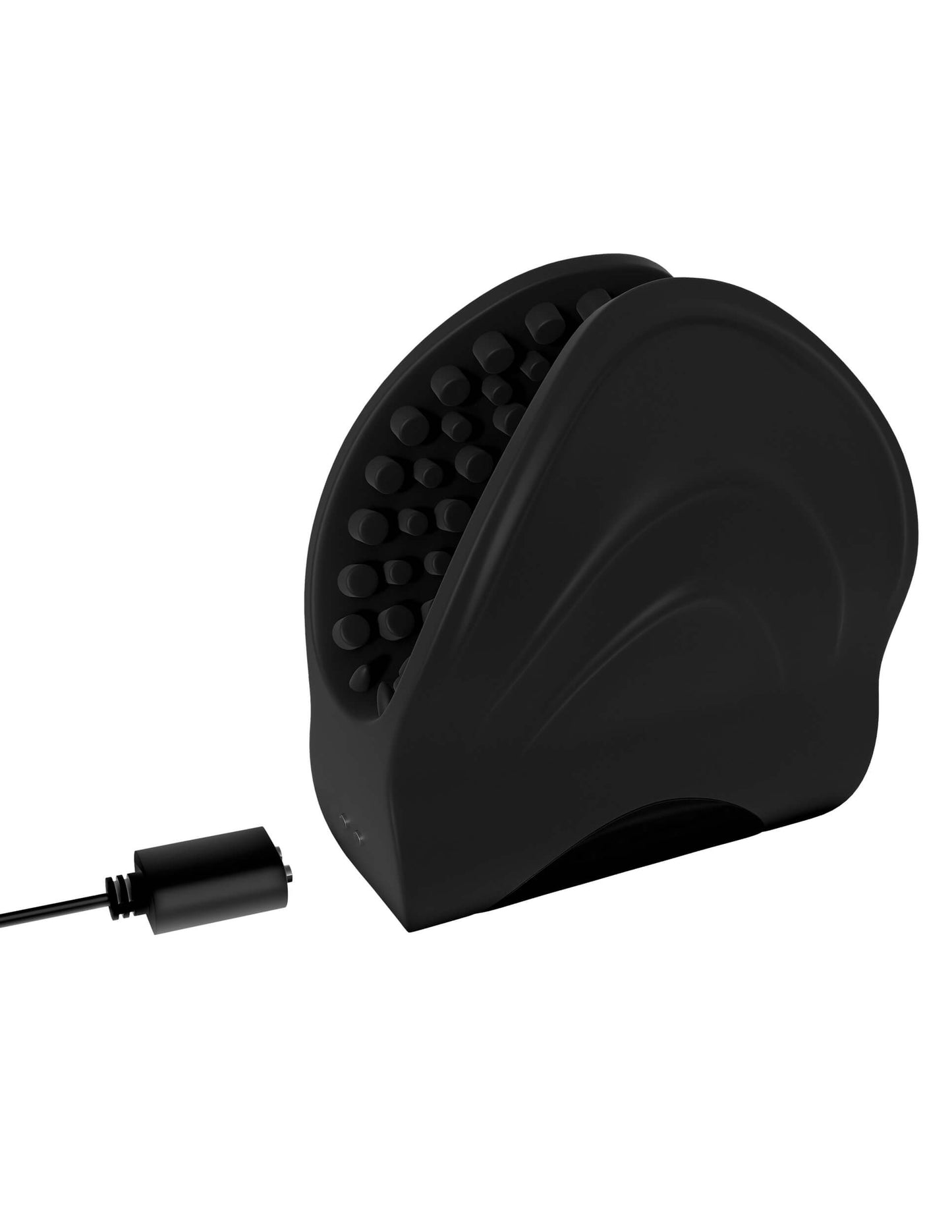 Sir Richards Vibrating Edging Trainer sitting out against a white background with the charger resting next to the magnetic charging ports on the toy. | Kinkly Shop