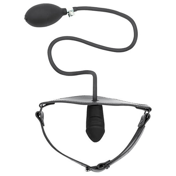Top-down view of the Spartacus Inflatable Penis Gag laid out against a white background. The gag's strap is fastened as if it was fitted onto a person's head, and the penis gag protrudes inward to the invisible "wearer". The inflation bulb and cord hang outside of the gag with the squishy, inflation-ready bulb ready to inflate the gag at a moment's notice. | Kinkly Shop
