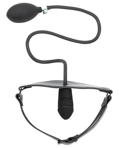 Top-down view of the Spartacus Inflatable Penis Gag laid out against a white background. The gag's strap is fastened as if it was fitted onto a person's head, and the penis gag protrudes inward to the invisible "wearer". The inflation bulb and cord hang outside of the gag with the squishy, inflation-ready bulb ready to inflate the gag at a moment's notice. | Kinkly Shop