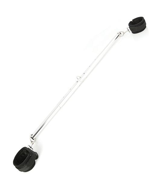 The Sportsheets Expandable Spreader Bar and Cuff set includes a long, metal bar with two bondage points on the end of each side of the bar. Attached to these each one of these bondage points is a black bondage cuff. Not shown, but the bar can be taken apart into three pieces for easy storage. | Kinkly Shop