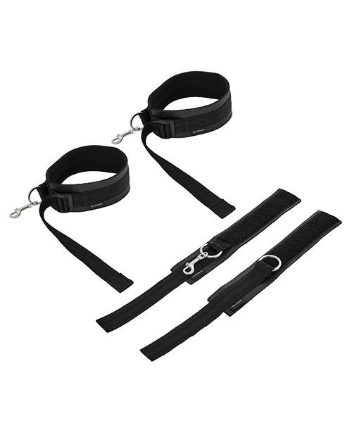 All four cuffs of the Sportsheets Thigh to Wrist Bondage Cuff Set sit out on a plain white background. The thigh cuffs are sitting upright and look like circular cuffs while the two wrist cuffs are laid flat. | Kinkly Shop