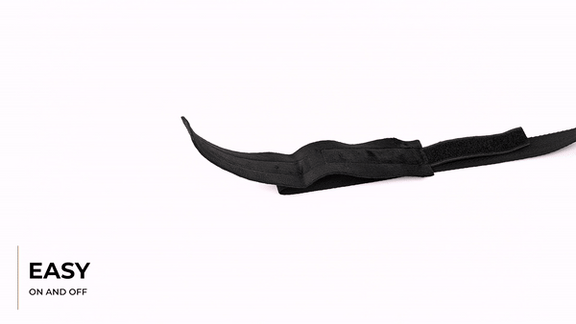 GIF shows a person using the Sportsheets Our First Bondage Kit. The person wraps a cuff around their wrist then uses the Velcro fastener to get it to stay on the wrist. It is very easy and fast to do. The person then tugs on the attached tether to show the durability. The text says "Easy on and off". | Kinkly Shop