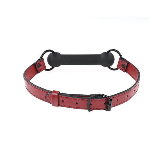 Close-up on the buckle fastener of the Sportsheets Saffron Silicone Bit Gag. It is a standard buckle that you'd expect to see on a belt. It has a lot of adjustment points to get a good fit for a variety of head sizes. | Kinkly Shop
