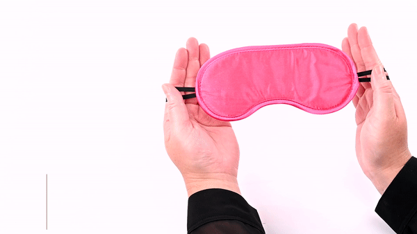 GIF of the Sportsheets Satin Blindfold. GIF shows a person's hands showing off both sides of the blindfold including the two, thin, dual-elastic straps (for a comfortable fit) that keeps the blindfold on the head. | Kinkly Shop