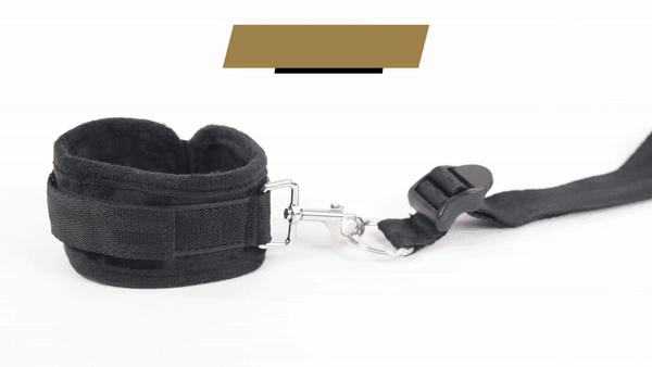 GIF shows a person disconnecting a cuff that comes with the Sportsheets Under the Bed Restraint System from the under-the-bed frame | Kinkly Shop