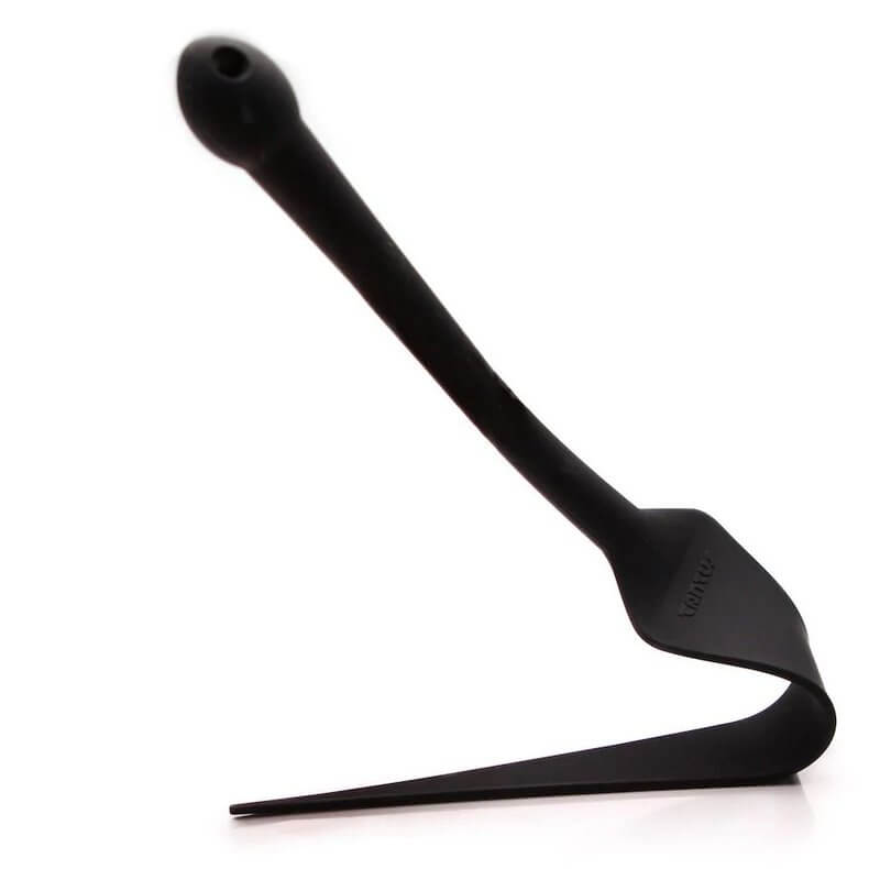 The Tantus Dragon Tail pressed up against a flat surface. The toy bends, easily, with no resistance. The tail of the Tantus Dragon Tail is extremely flexible. | Kinkly Shop