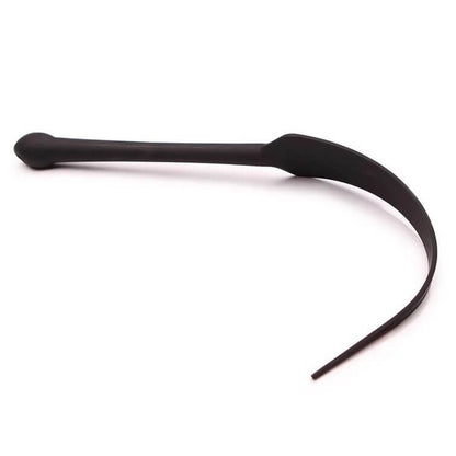 The Tantus Dragon Tail laying against a white background. The tail of the Tantus Dragon Tail is bent into a half-circle shape. | Kinkly Shop