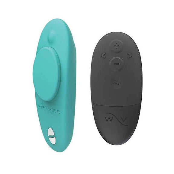 We-Vibe Moxie+ Panty Vibe sitting next to the included remote. The remote is black in color while the vibrator is a light aqua color. | Kinkly Shop
