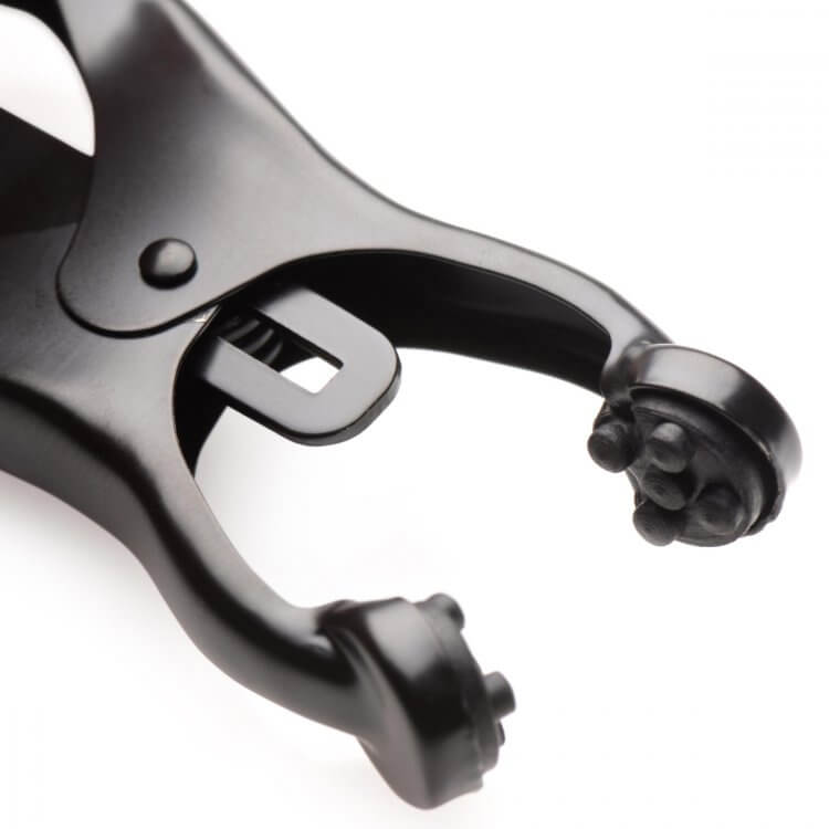 Close-up of the textured grips inside of the nipple clamp tips. These will add extra intensity when using the Master Series Monarch Noir nipple clamps. | Kinkly Shop