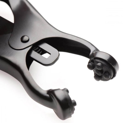 Close-up of the textured grips inside of the nipple clamp tips. These will add extra intensity when using the Master Series Monarch Noir nipple clamps. | Kinkly Shop