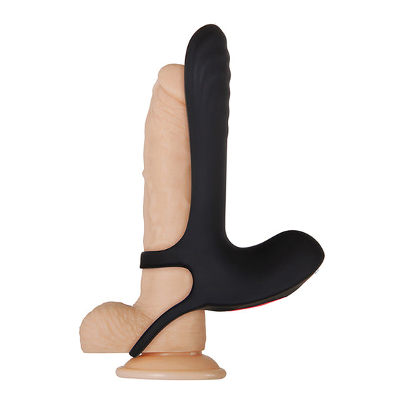 The Zero Tolerance Vibrating Girth Enhancer Extension is strapped onto a realistic-looking sand-color dildo. This shows the stability straps for the penis vibrator along the base of the shaft and beneath the testicles. | Kinkly Shop