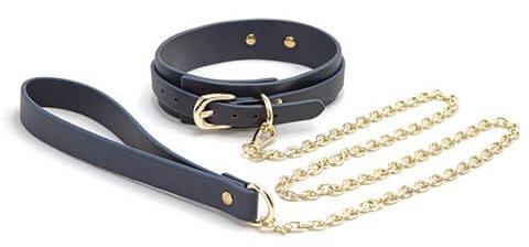 The NS Novelties Bondage Couture Vinyl Collar and Leash up against a plain white background | Kinkly Shop