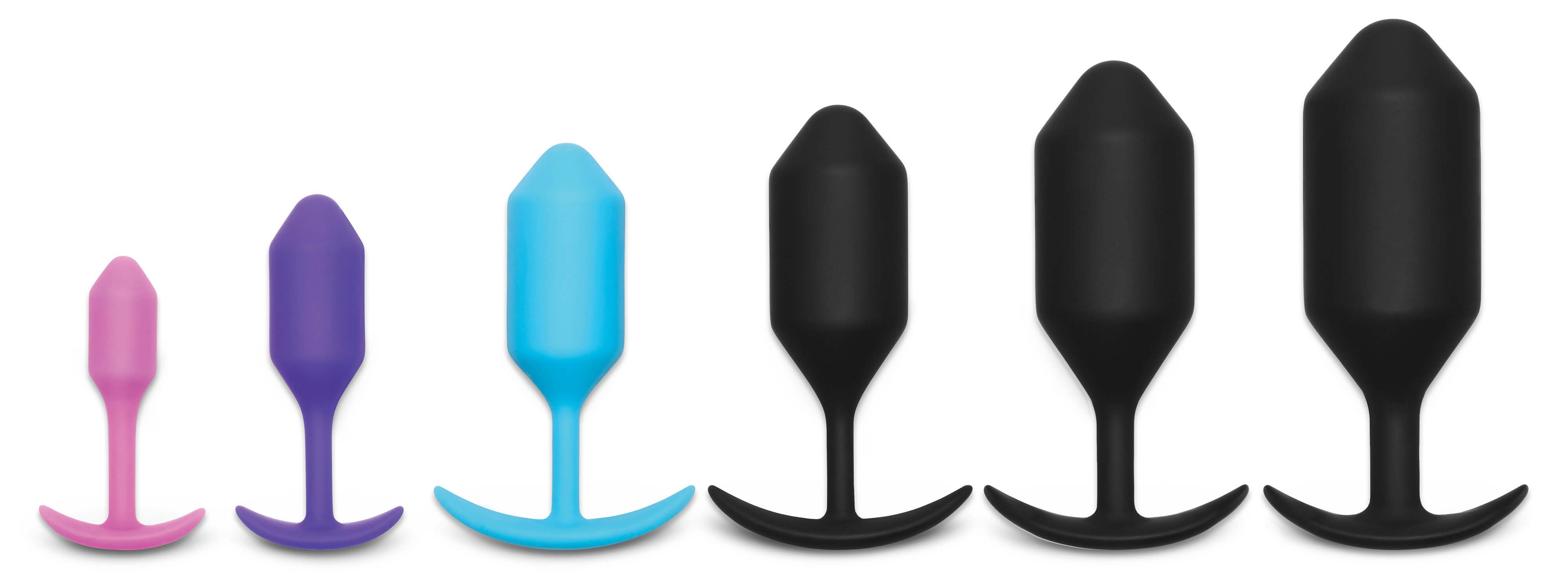 The entire b-Vibe Snug Plugs line-up, one next to another, lined up left to right from small to large. | Kinkly Shop