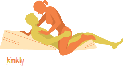 Rhombus sex position. The penetrating partner is lying flat on the ground on top of two Liberator shapes. The Ramp is propping up their entire upper body on an angled surface, and the Wedge is propping their thighs up on an upward angle. The receiving partner is kneeling on top of their partner like a modified Cowgirl position. 