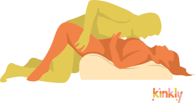 Marc Anthony sex position. The receiving partner is laying on their back with their hips positioned on the tallest end of the Hipster. The penetrating partner is kneeling in front of the Hipster with their hips in-between of the receiving partner's knees. | Kinkly