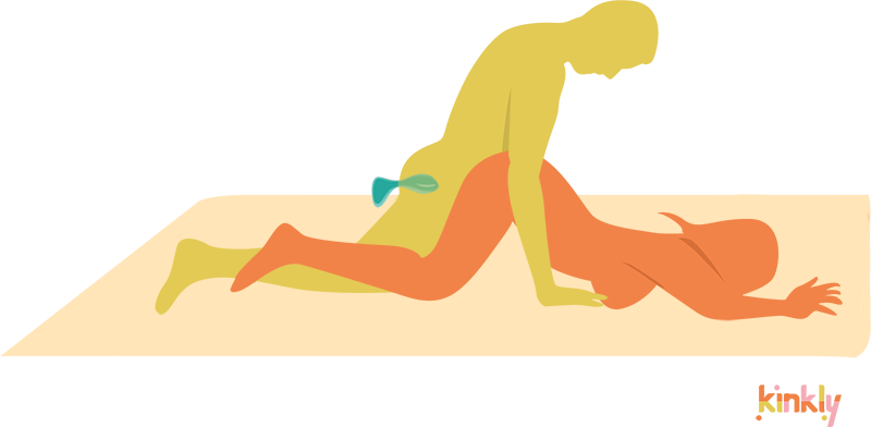 Flat Doggy Style Position. Doggy style but receiving partner is lying flat with their bum in the air. The penetrating partner has an anal plug in their butt.