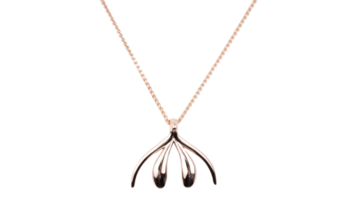 Vulva shaped pendant on a gold chain by Sophia Wallace