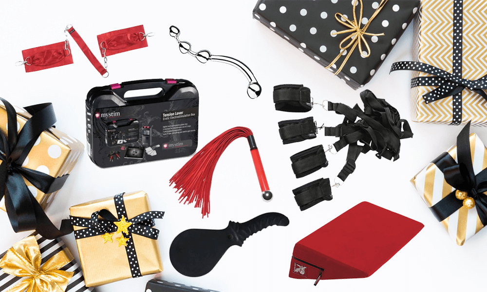 kinky BDSM sex toys and restraints with wrapped gifts
