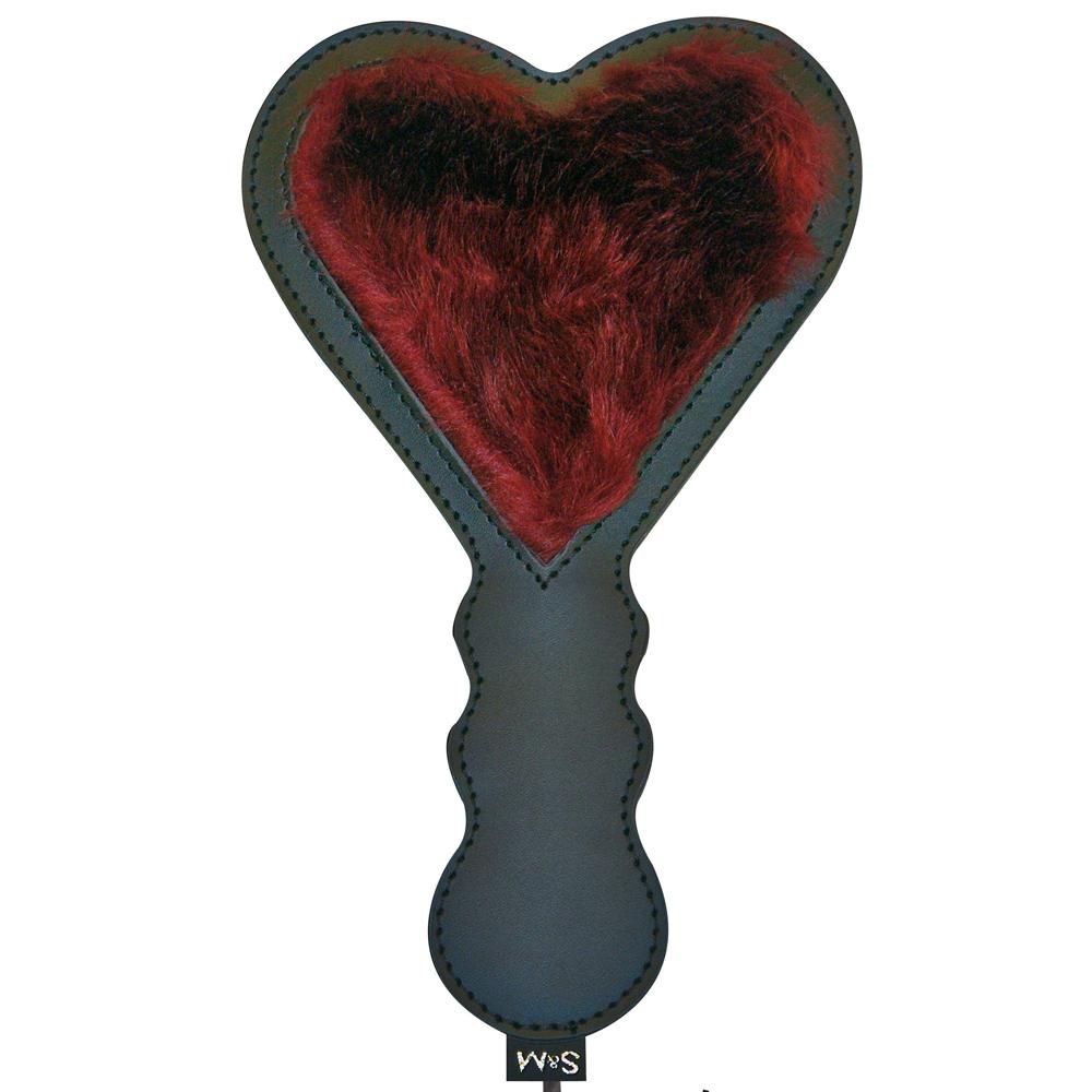 The Sportsheets Enchanted Heart Paddle: A heart-shaped paddle with red fluff on the wide end and a textured black handle designed for easy gripping.