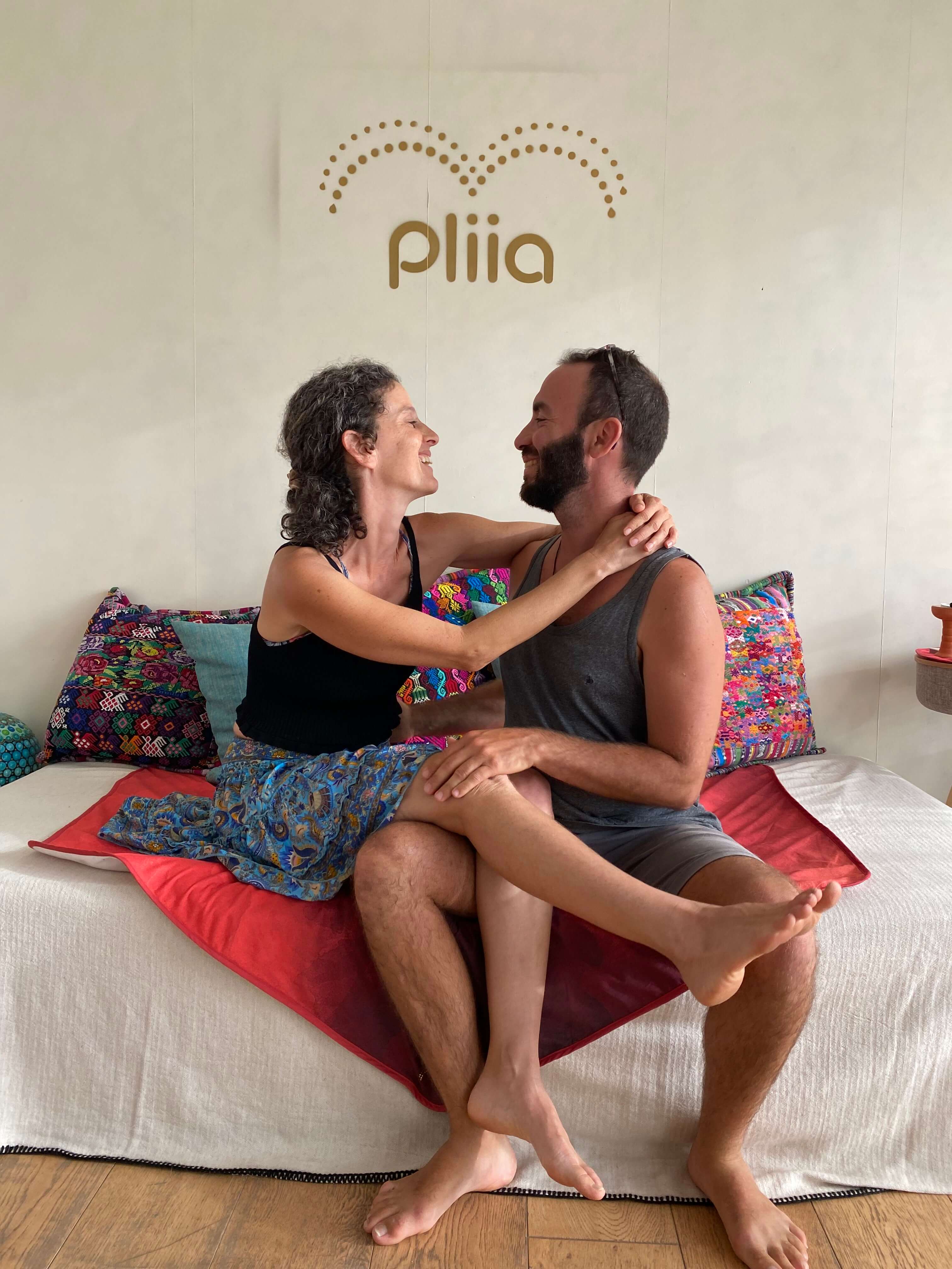 Two people embrace on top of the Pliia Mat - Hexagon in Mauna Loa.