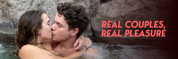 Lustery.com banner of two people kissing in a hot spring
