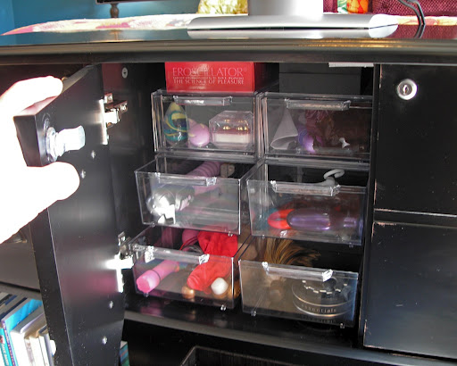 locking cabinet with drawers full of sex toys